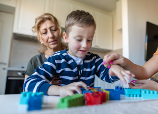 young child playing with blocks
